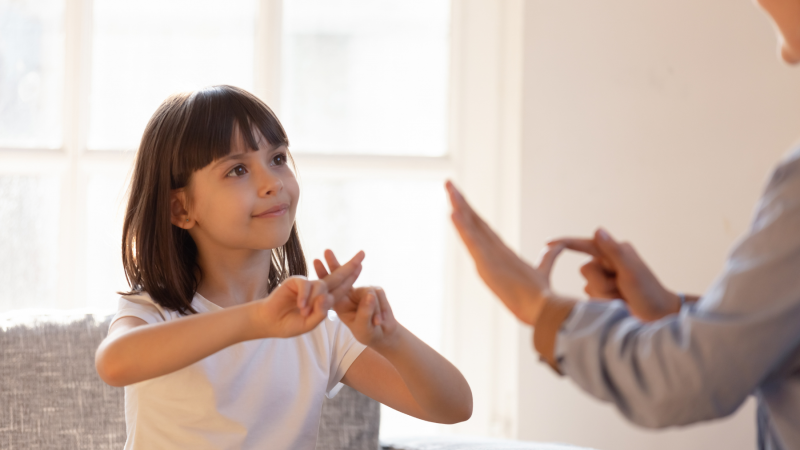 Child using British Sign Language