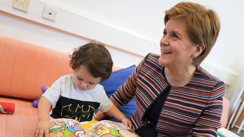 The First Minister is with a child