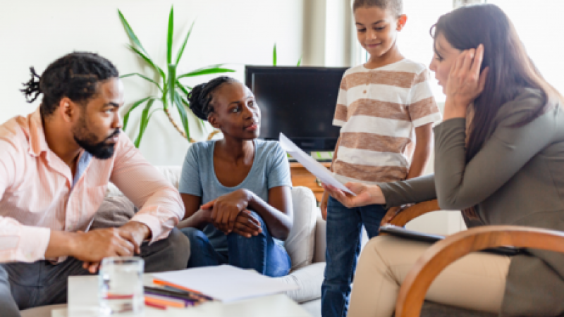 Child and adults talking