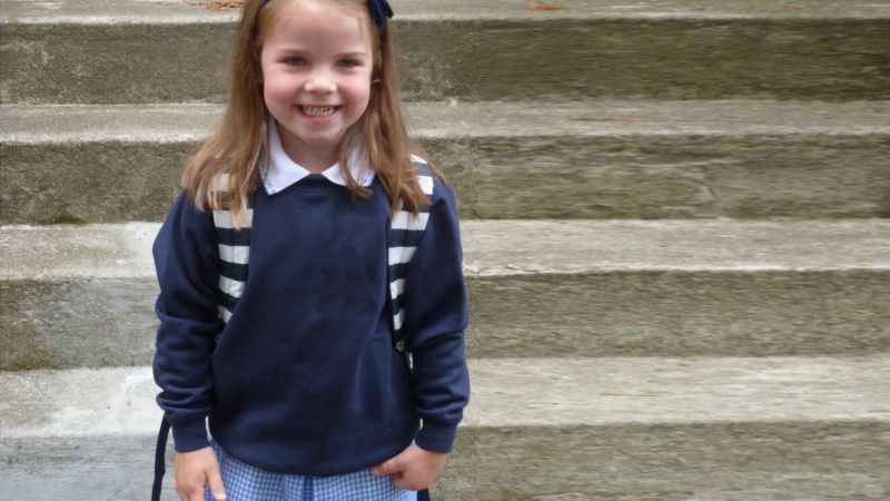 Young girl on first day of school