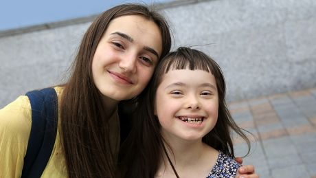 two young girls smiling for a photo