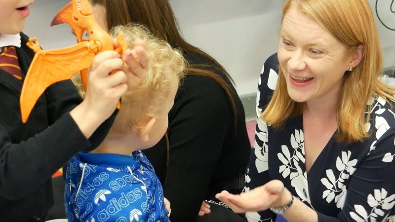 Cabinet Secretary, Shirley Anne Somerville smiling at a young child