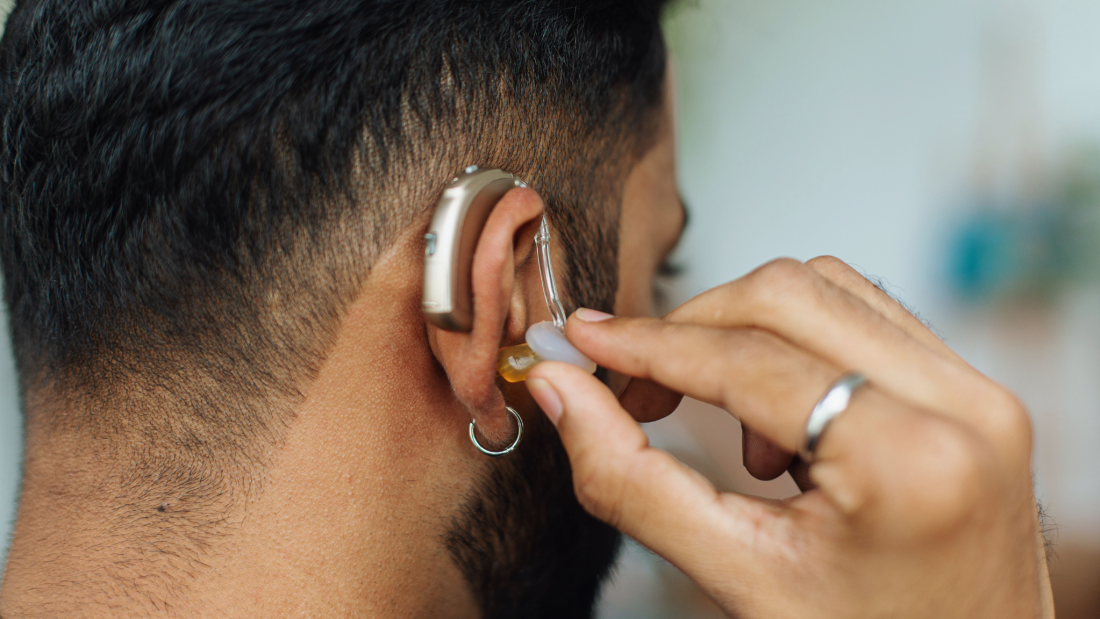 Close-up of someone wearing a hearing aid