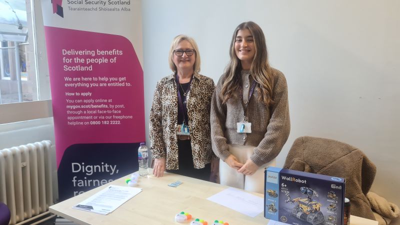 Colleagues standing at Social Security Scotland stall