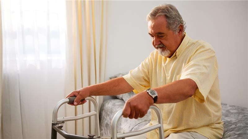 Man with walking frame
